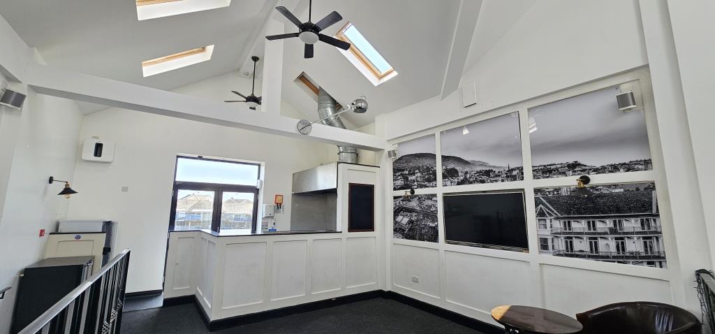 Lot: 173 - TOWN CENTRE FREEHOLD THREE STOREY BAR WITH GARDEN AND PARKING - View towards the food prep area